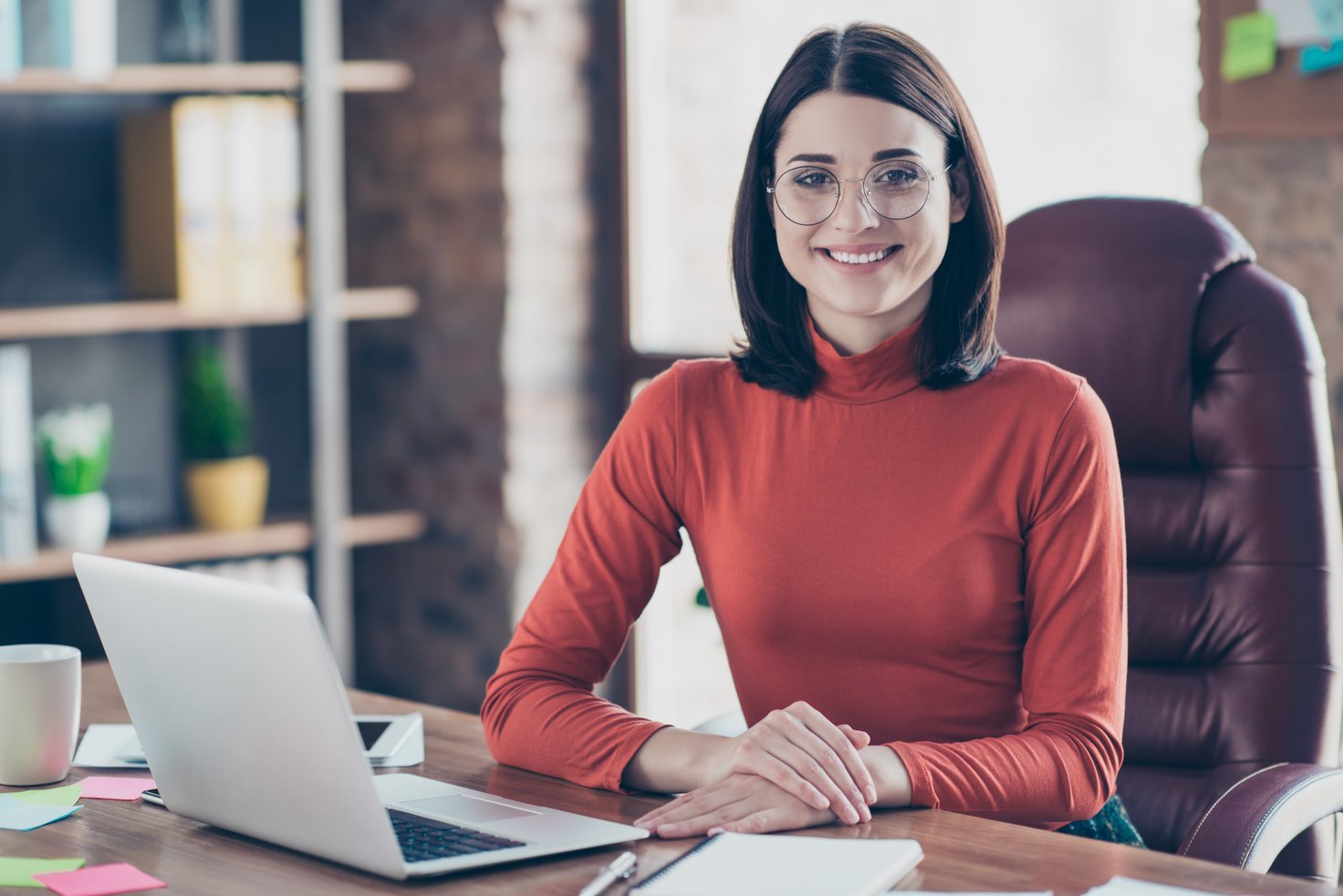 Leadership leader professional employment employee staff company studying people person concept. Pretty smart clever charming lady boss sitting at the table keeping holding hands on desk pullover